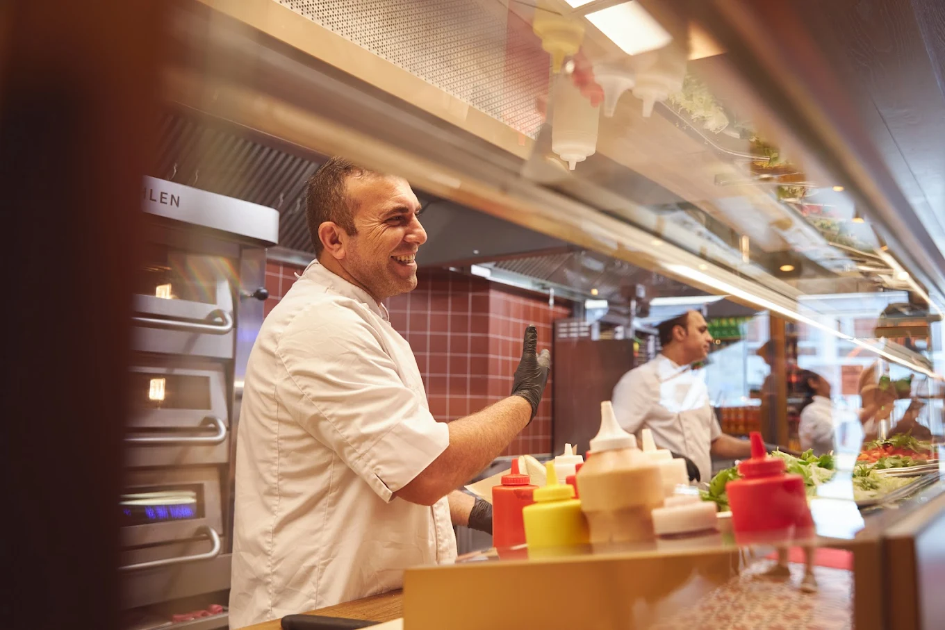 Dalia chef at the open kitchen counter